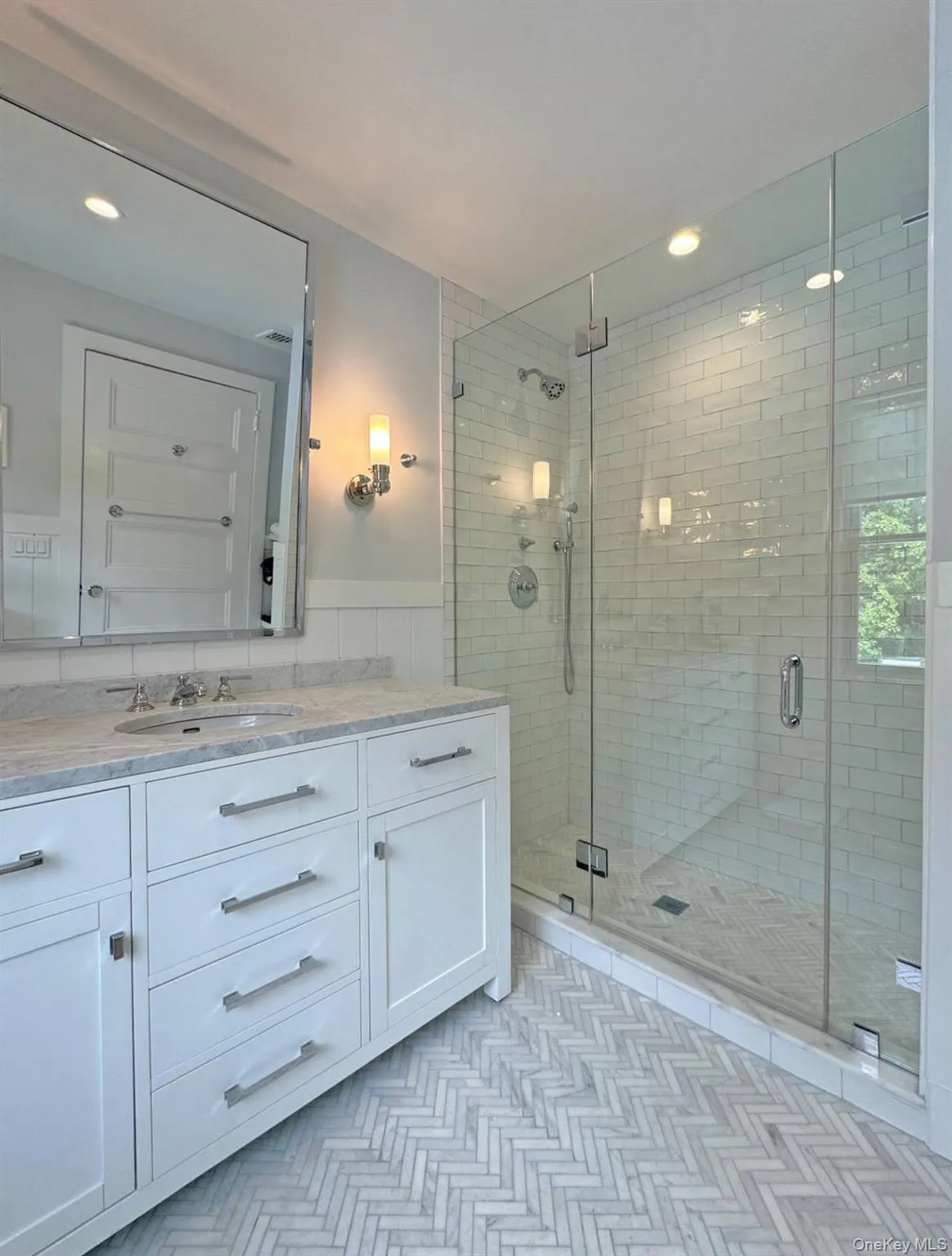 Bathroom featuring vanity, wainscoting, a stall shower, and recessed lighting Bathroom featuring vanity, wainscoting, a stall shower, and recessed lighting