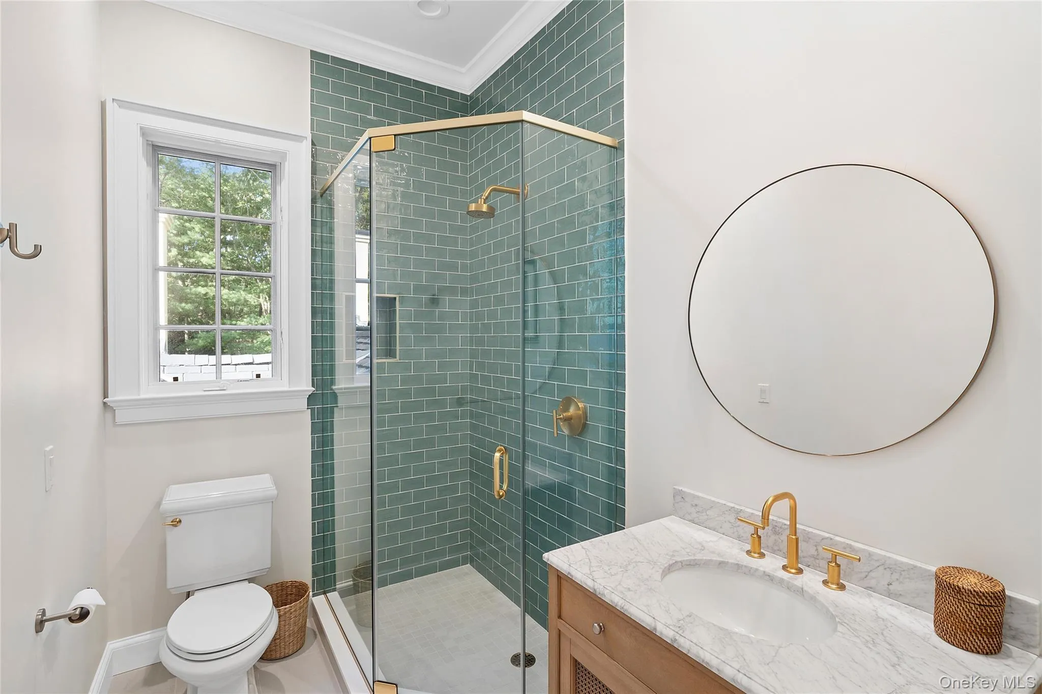Full bathroom featuring vanity, a stall shower, and ornamental molding Full bathroom featuring vanity, a stall shower, and ornamental molding