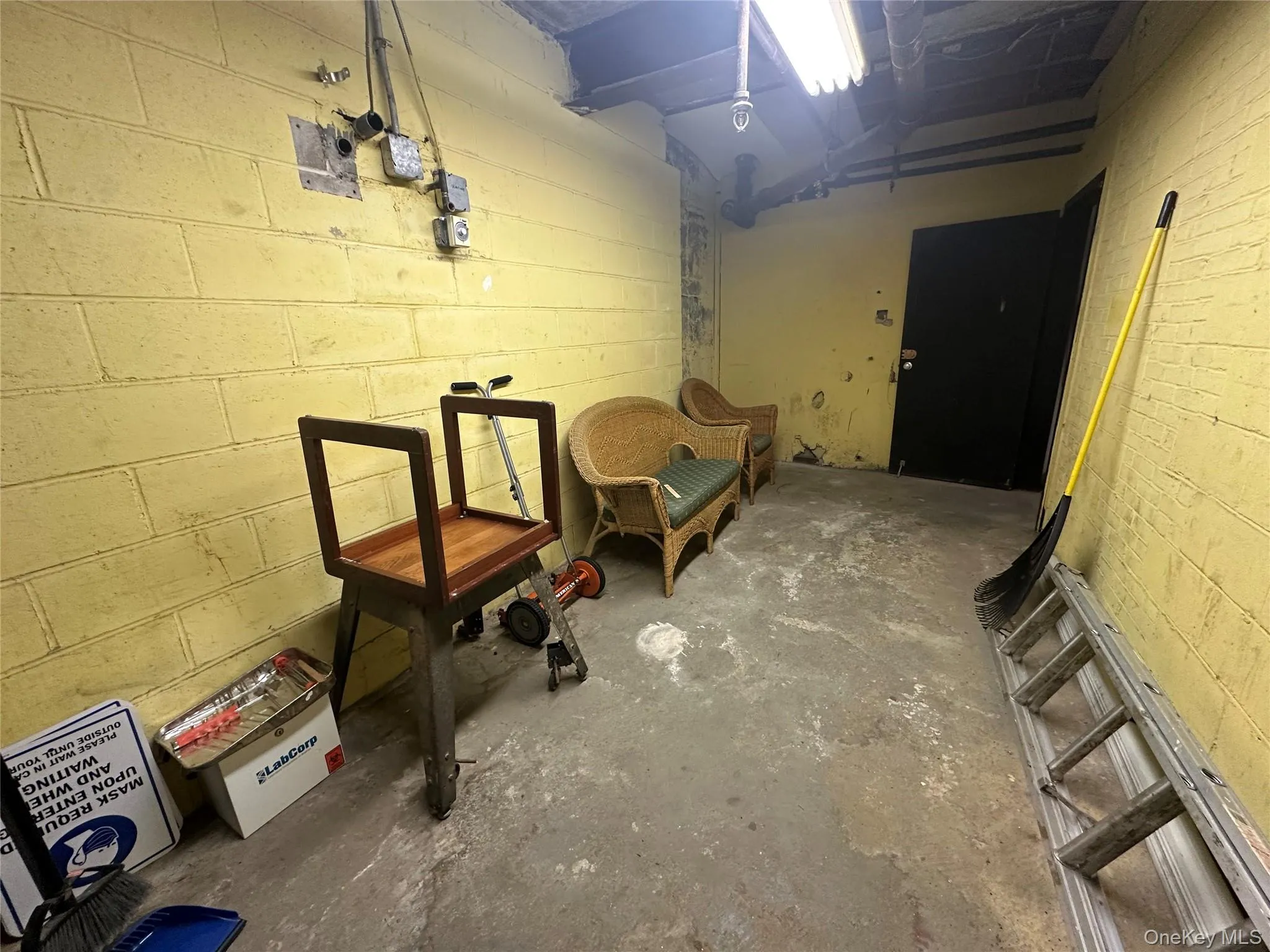 Unfinished below grade area with concrete block wall Unfinished below grade area with concrete block wall