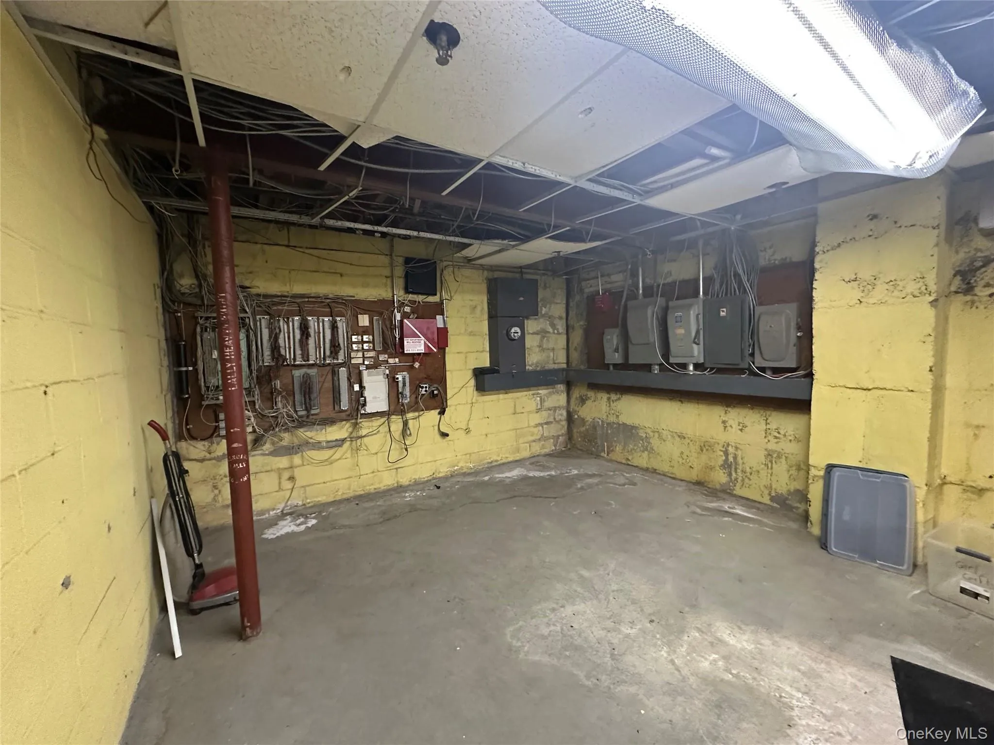 Unfinished basement featuring electric panel Unfinished basement featuring electric panel