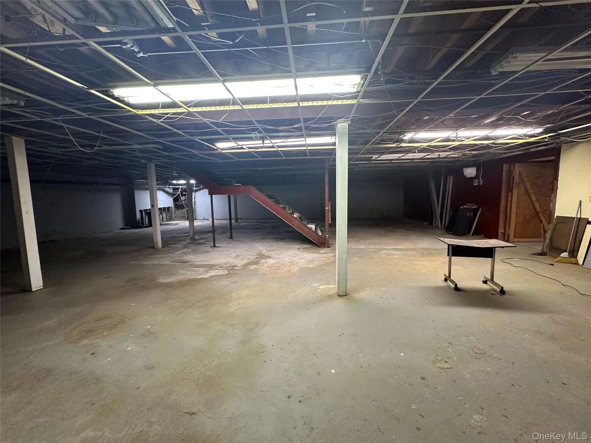 Unfinished basement with stairway Unfinished basement with stairway