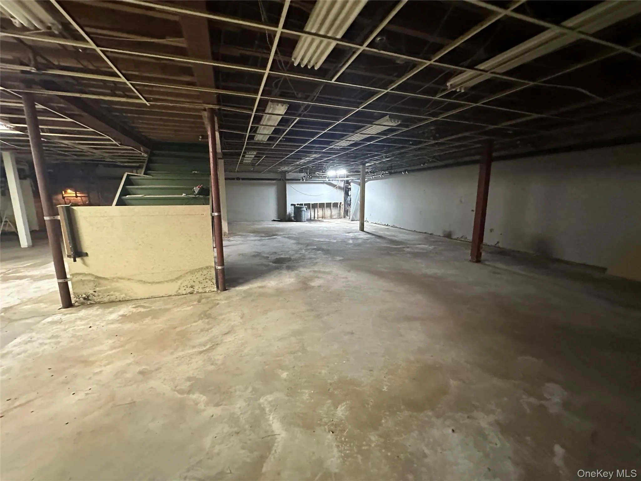 Unfinished below grade area with stairway Unfinished below grade area with stairway