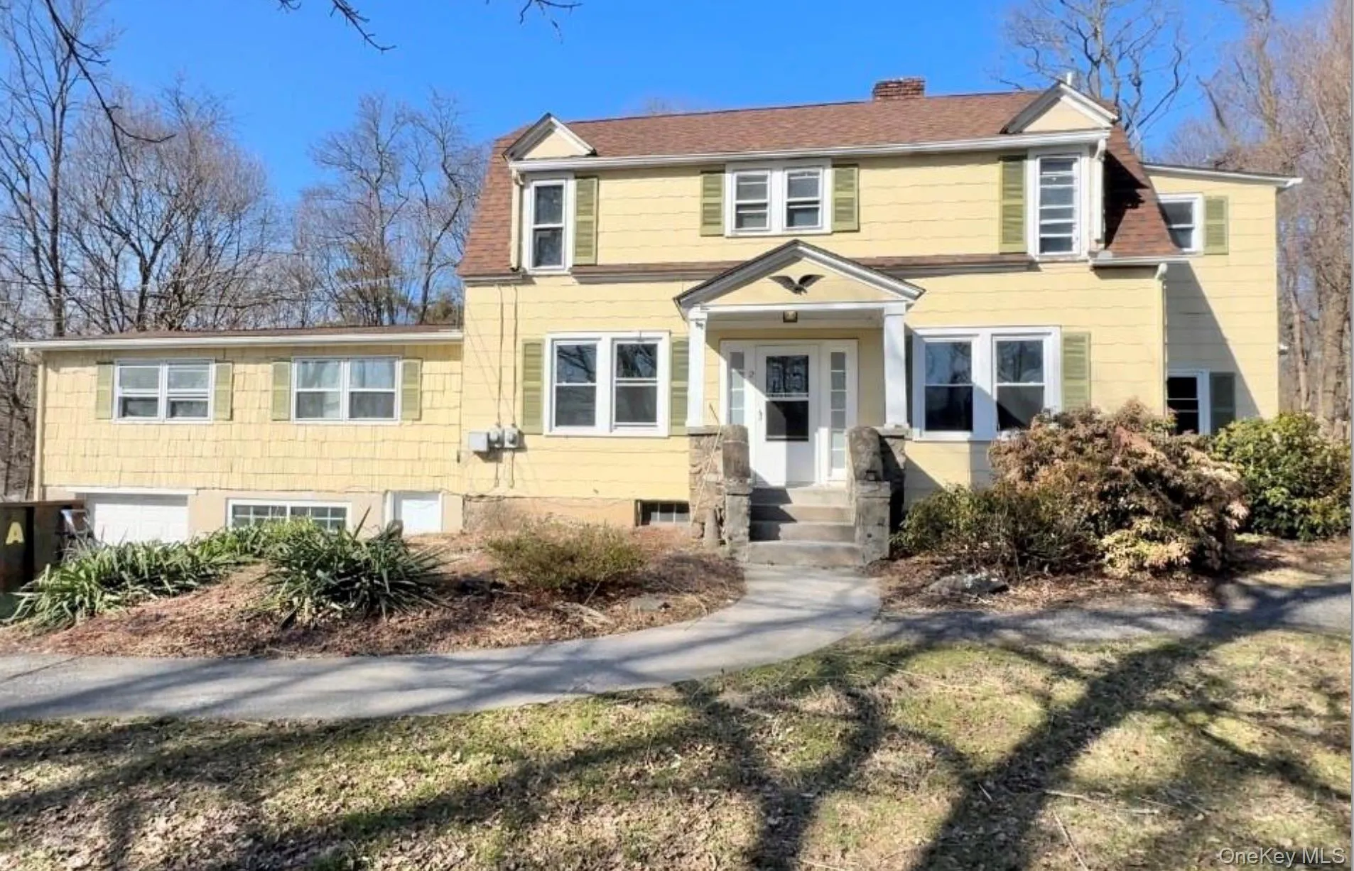 View of front of house featuring a chimney View of front of house featuring a chimney