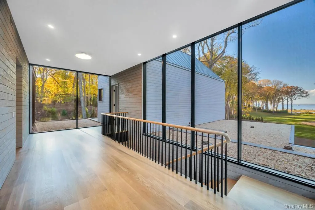 Unfurnished sunroom with a water view Unfurnished sunroom with a water view
