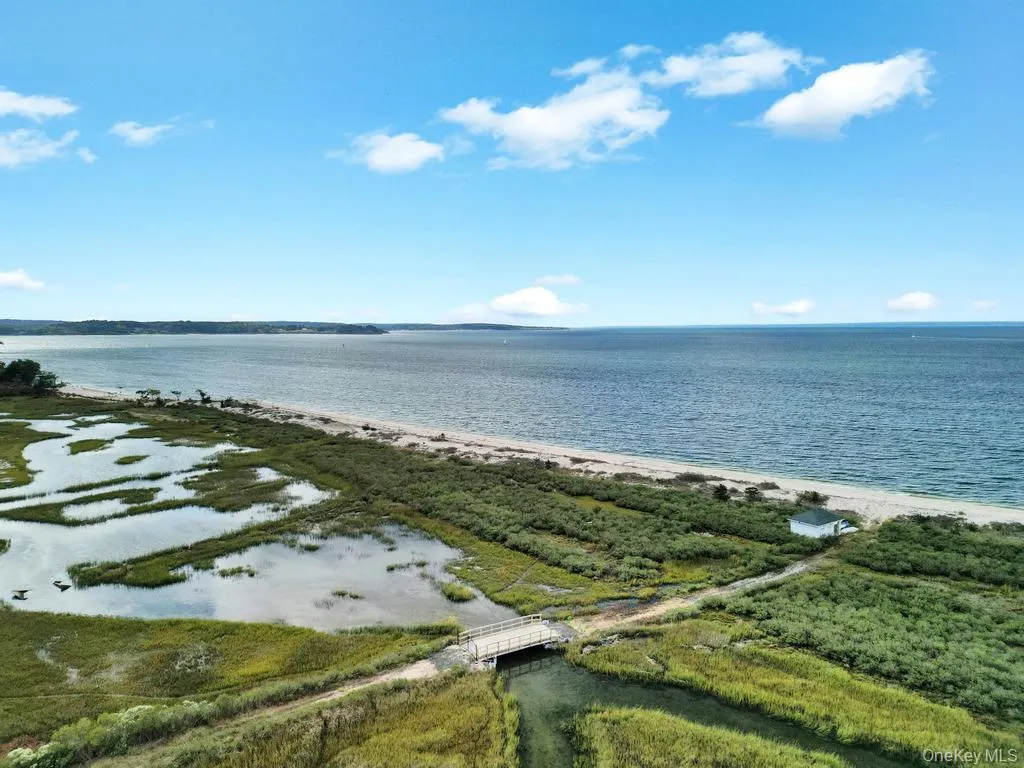 Water view featuring nearby beach Water view featuring nearby beach