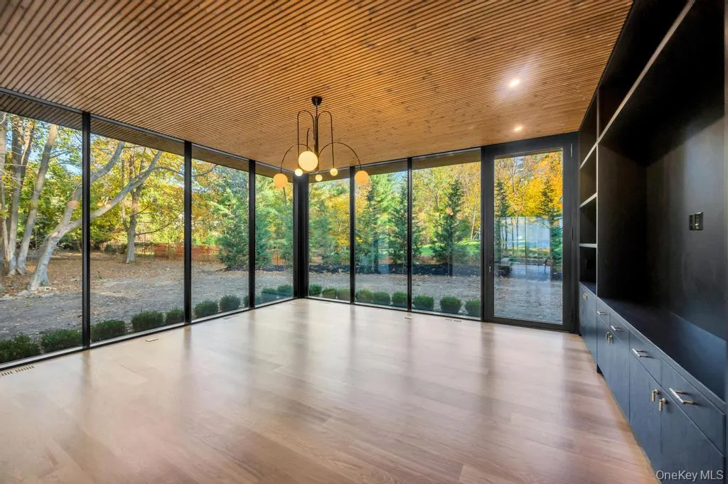 Unfurnished sunroom with a chandelier Unfurnished sunroom with a chandelier