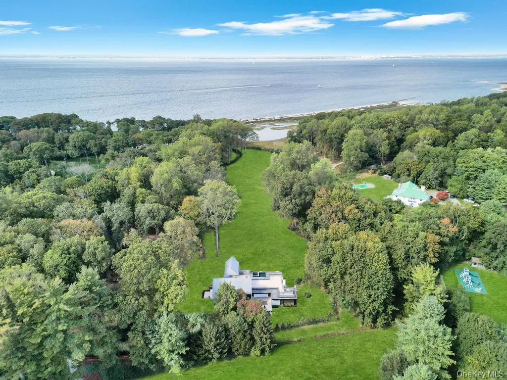 Aerial overview of property's location with a nearby body of water Aerial overview of property's location with a nearby body of water