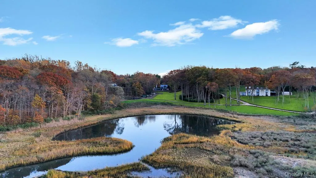 View of property's community with a water view and a yard View of property's community with a water view and a yard