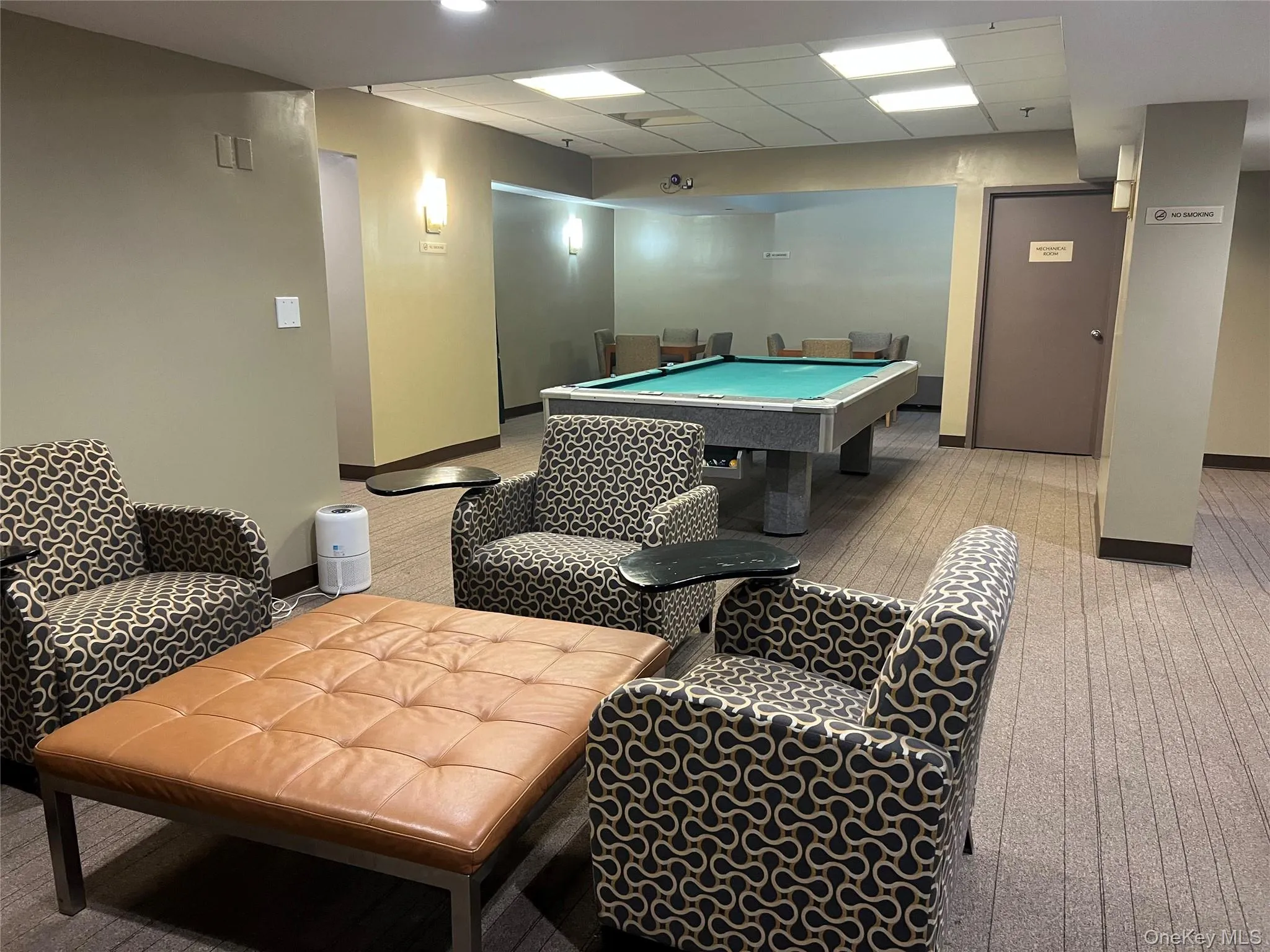 Game room with a paneled ceiling and pool table Game room with a paneled ceiling and pool table