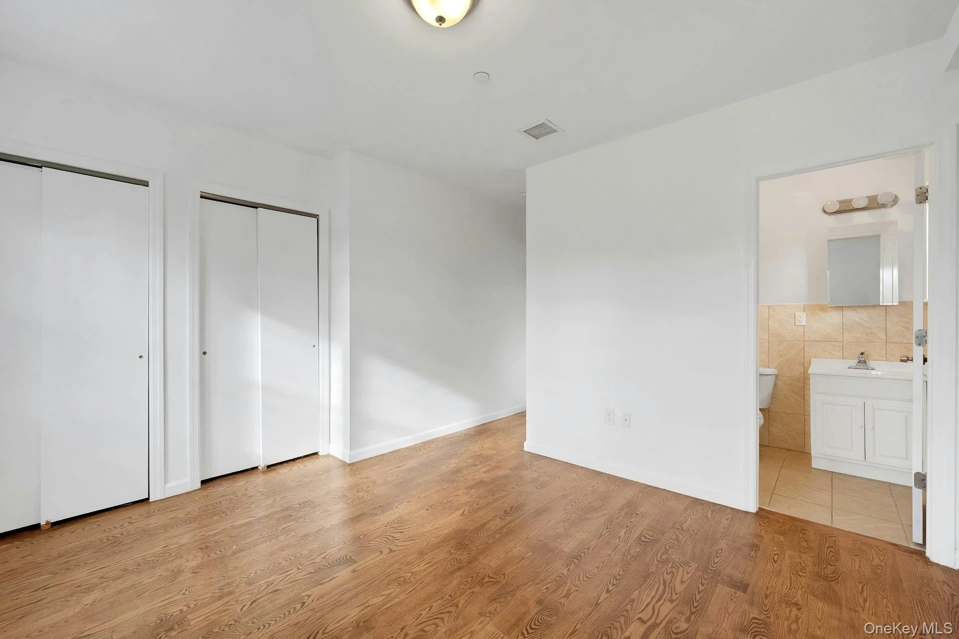 Second floor primary bedroom with bathroom and 2 closets Second floor primary bedroom with bathroom and 2 closets