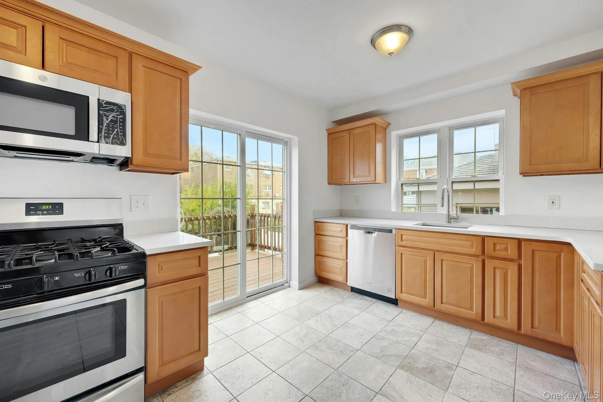 Kitchen with stainless steel appliances and Quartz counters Kitchen with stainless steel appliances and Quartz counters
