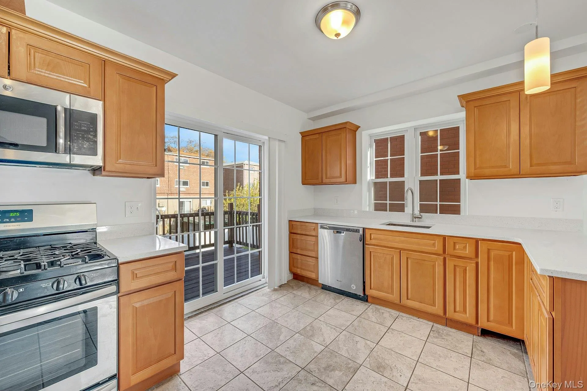 Kitchen with stainless steel appliances and Quartz counters Kitchen with stainless steel appliances and Quartz counters