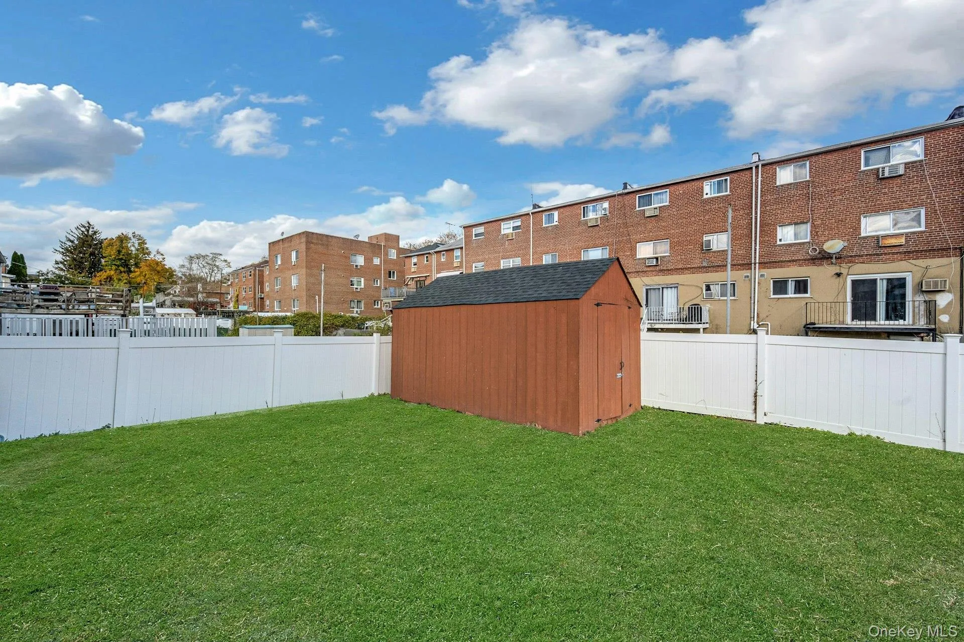 Fenced backyard featuring a storage shed Fenced backyard featuring a storage shed