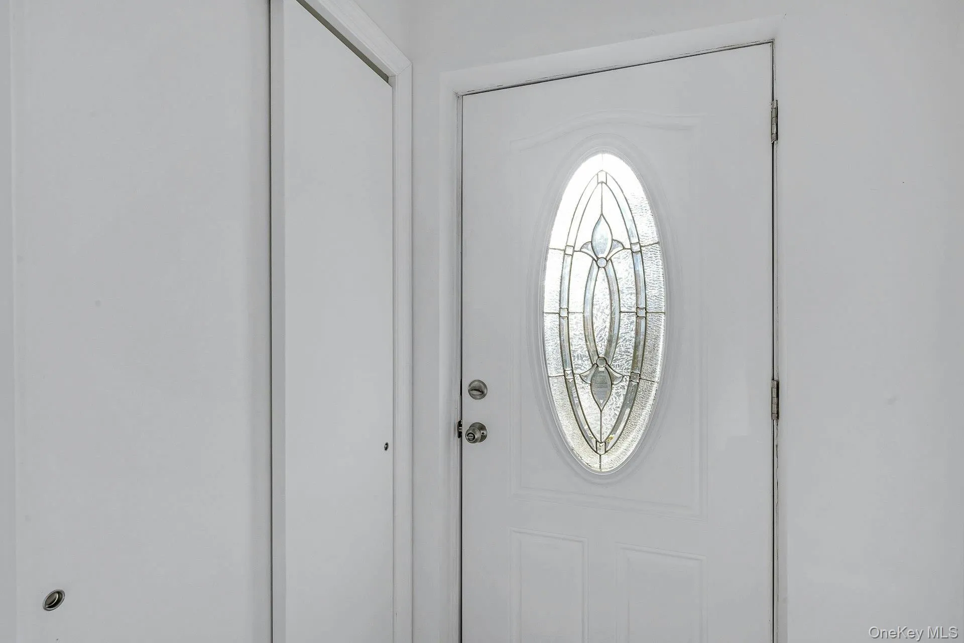 View of foyer entrance with closet View of foyer entrance with closet