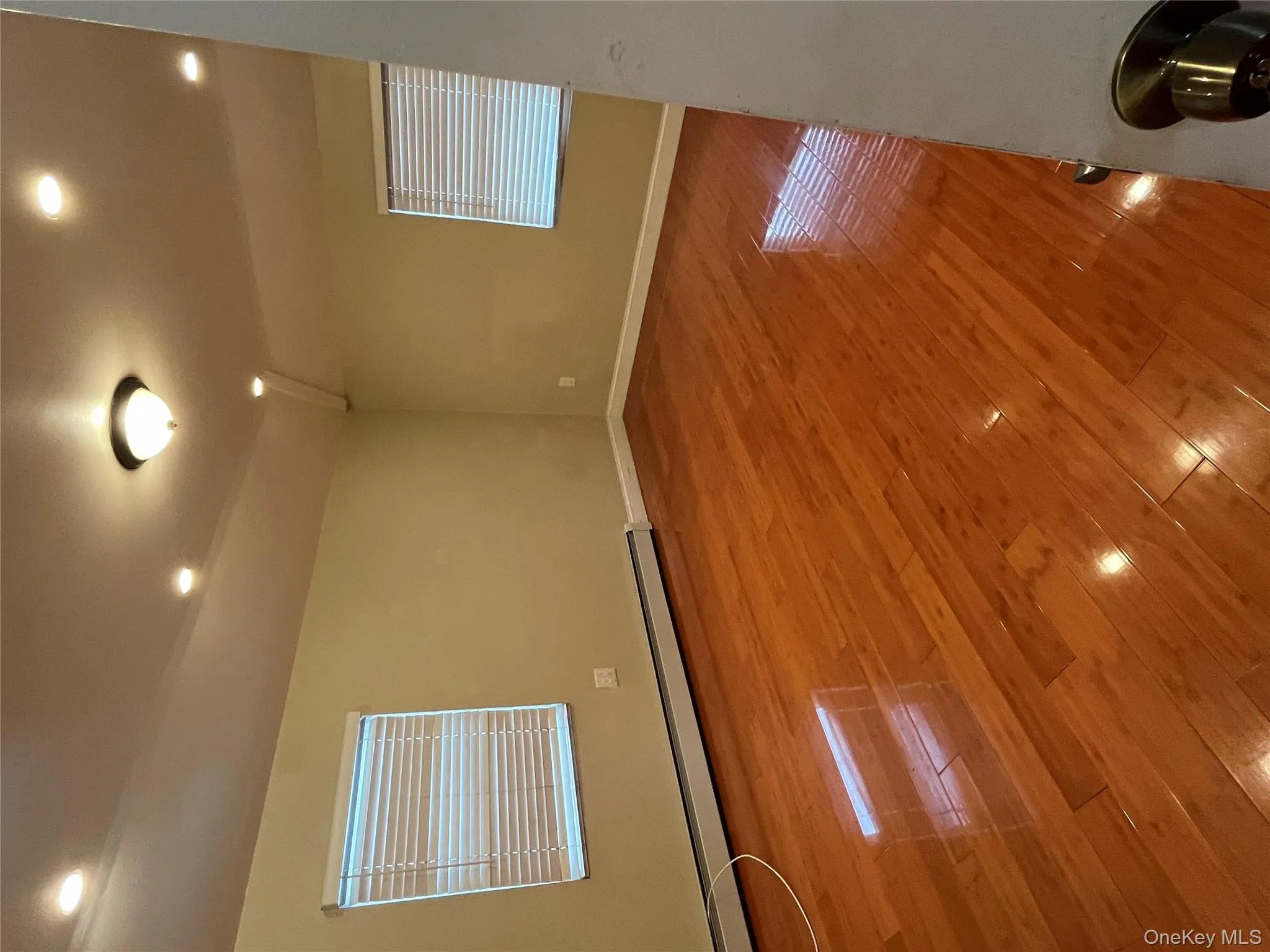 Unfurnished room with recessed lighting, a baseboard radiator, and light wood finished floors Unfurnished room with recessed lighting, a baseboard radiator, and light wood finished floors