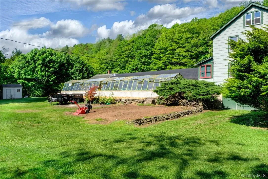 Garden Bed in front of Greenhouse Garden Bed in front of Greenhouse