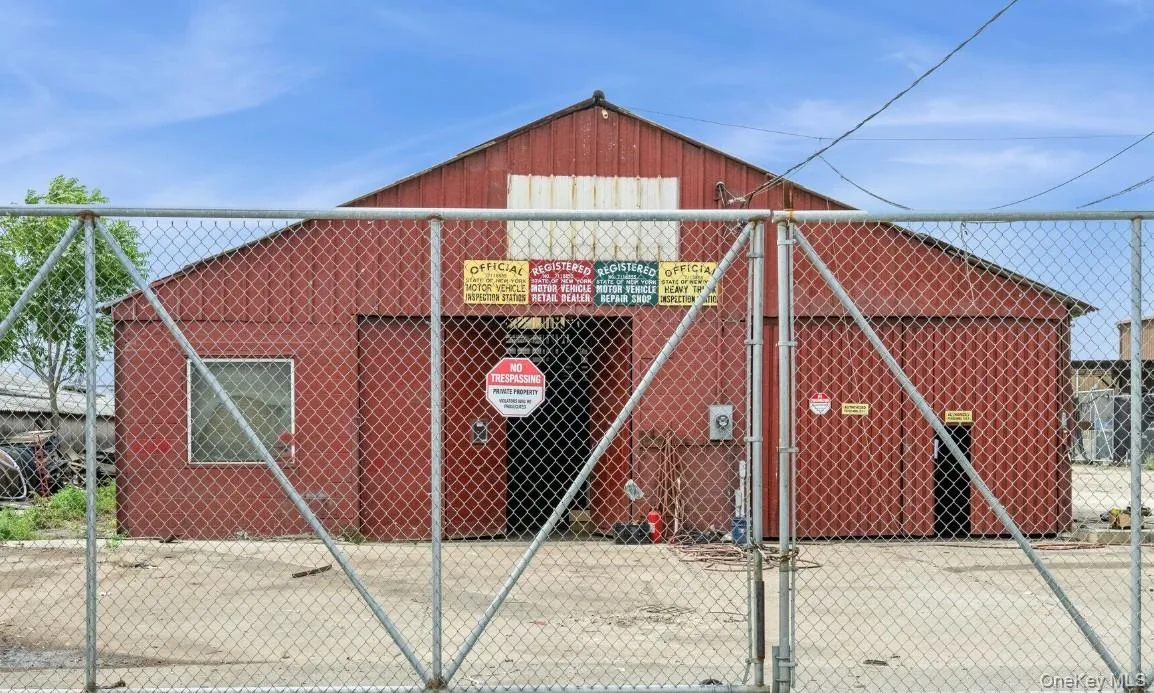 View of outdoor structure with a gate View of outdoor structure with a gate
