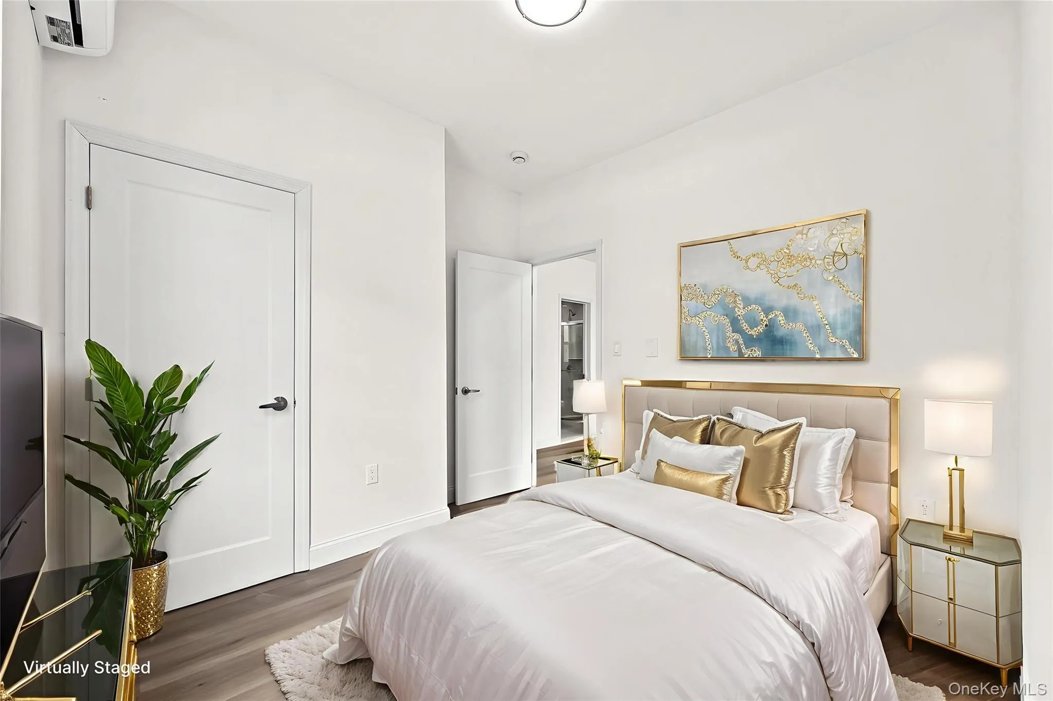Bedroom with wood finished floors and baseboards Bedroom with wood finished floors and baseboards