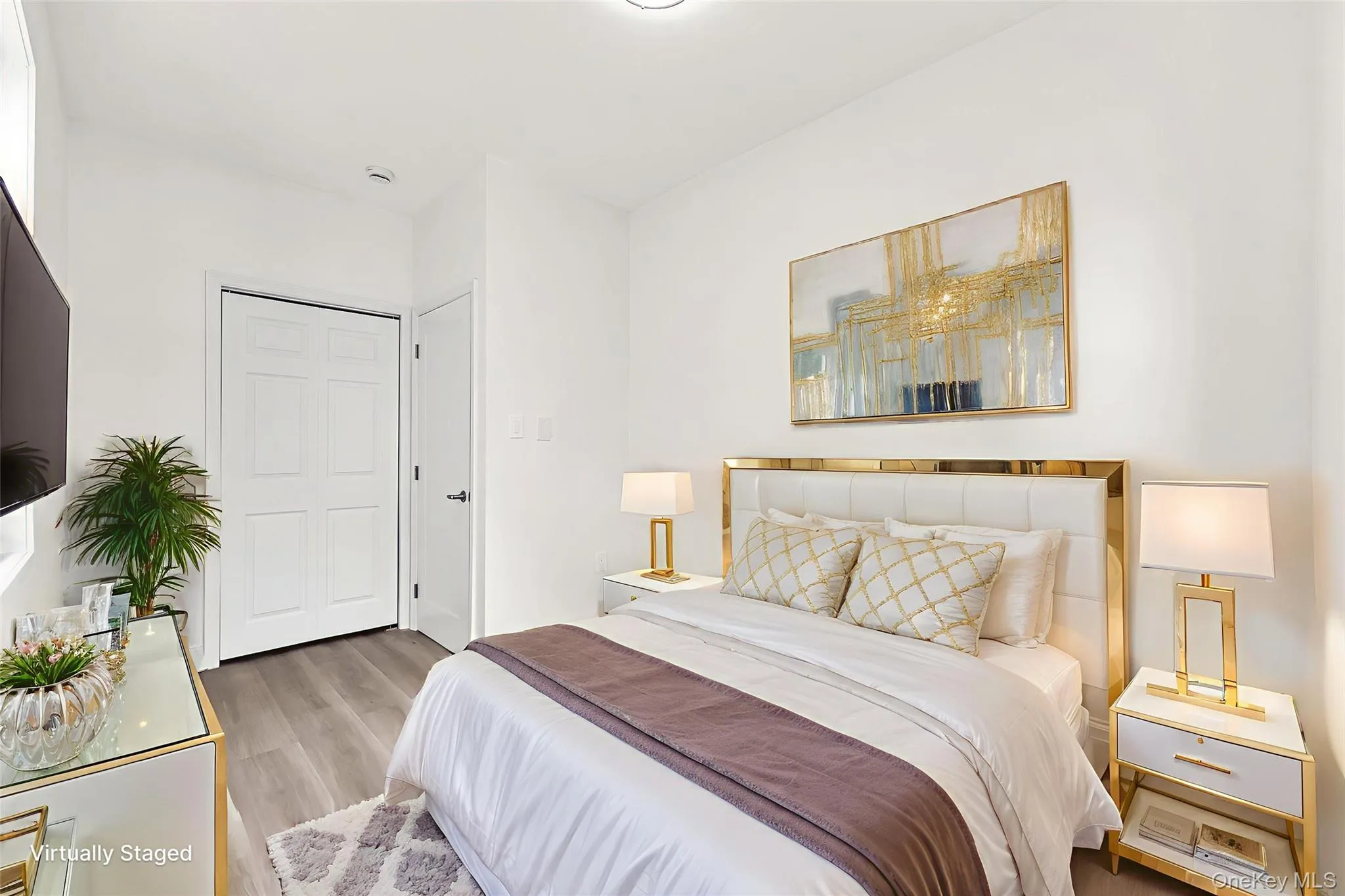 Bedroom featuring light wood finished floors Bedroom featuring light wood finished floors