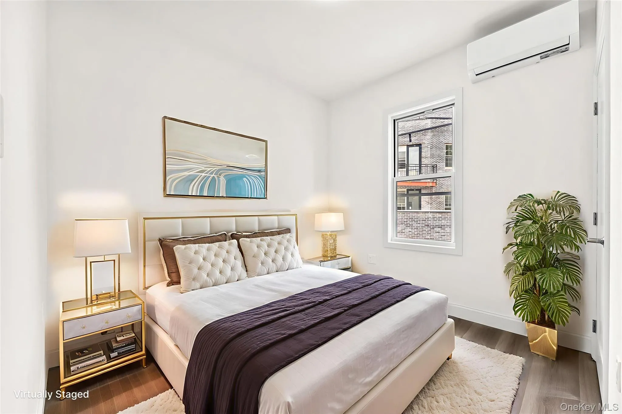 Bedroom with an AC wall unit and dark wood-style floors Bedroom with an AC wall unit and dark wood-style floors