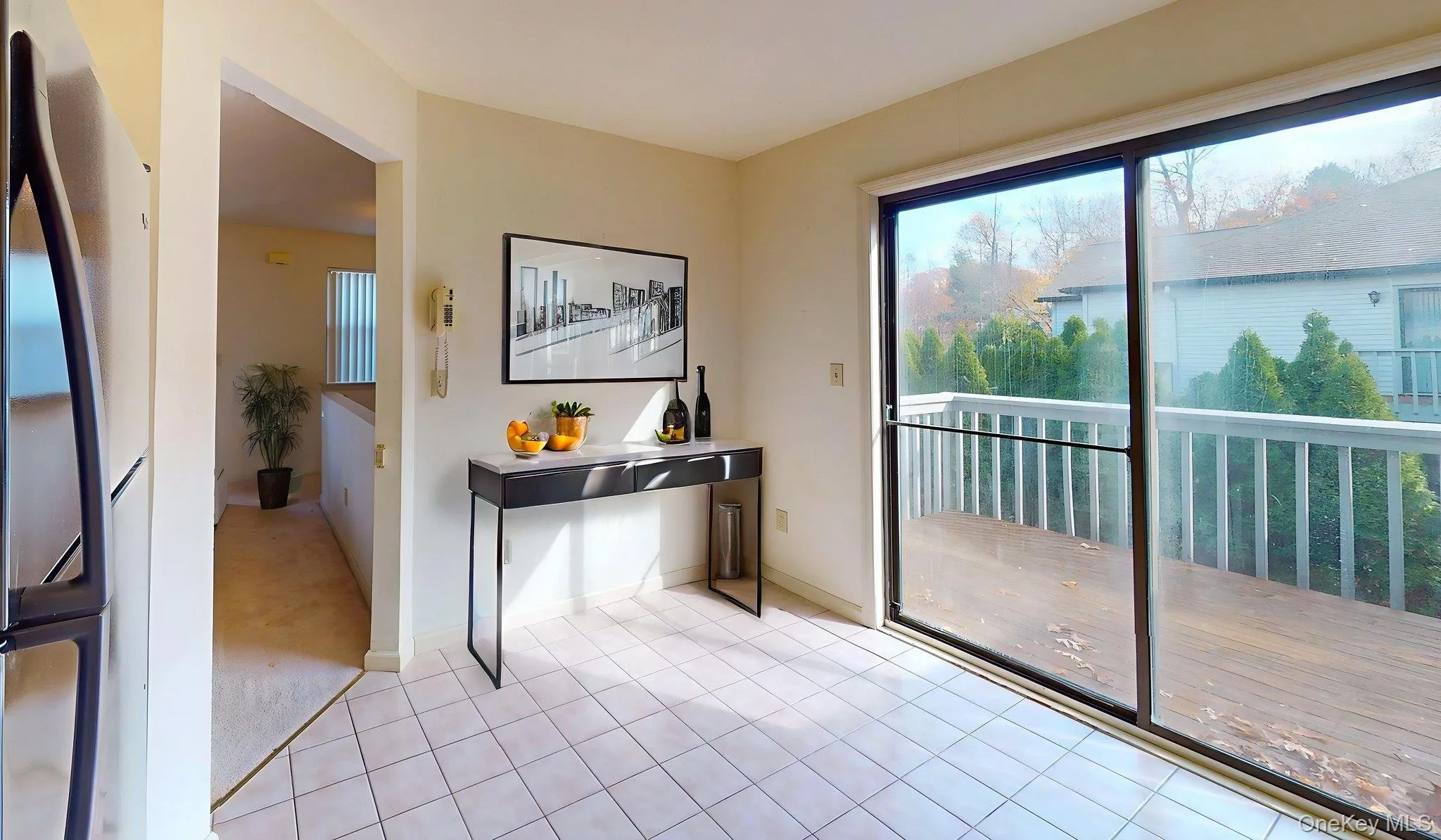 Entryway with tile patterned flooring and baseboards Entryway with tile patterned flooring and baseboards