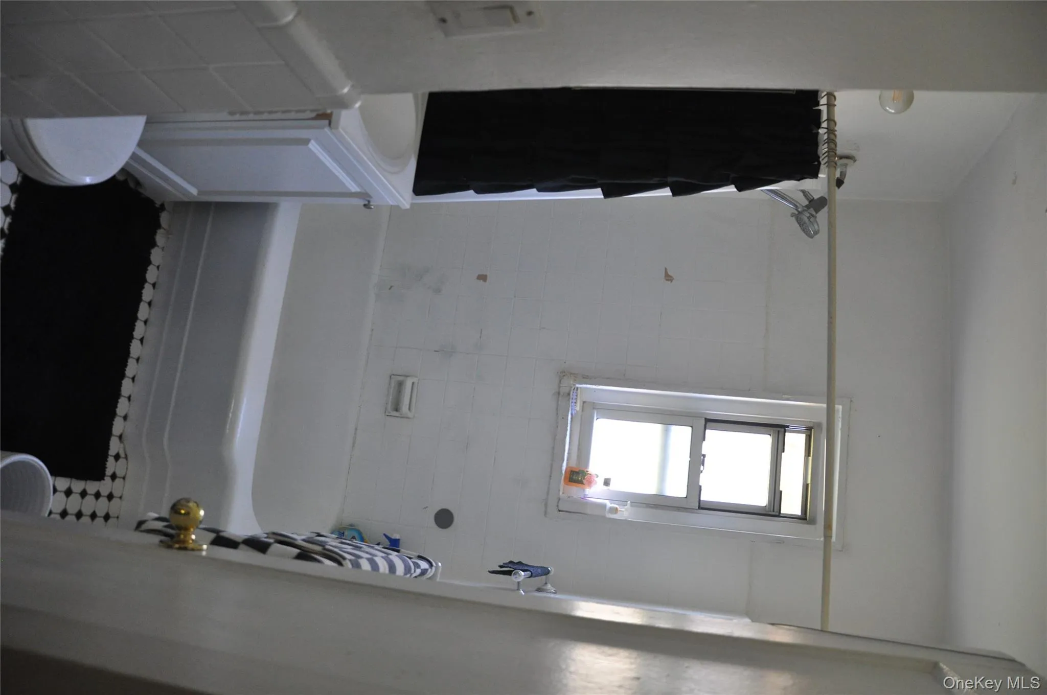 Full bathroom featuring vanity and shower / bath combo with shower curtain Full bathroom featuring vanity and shower / bath combo with shower curtain