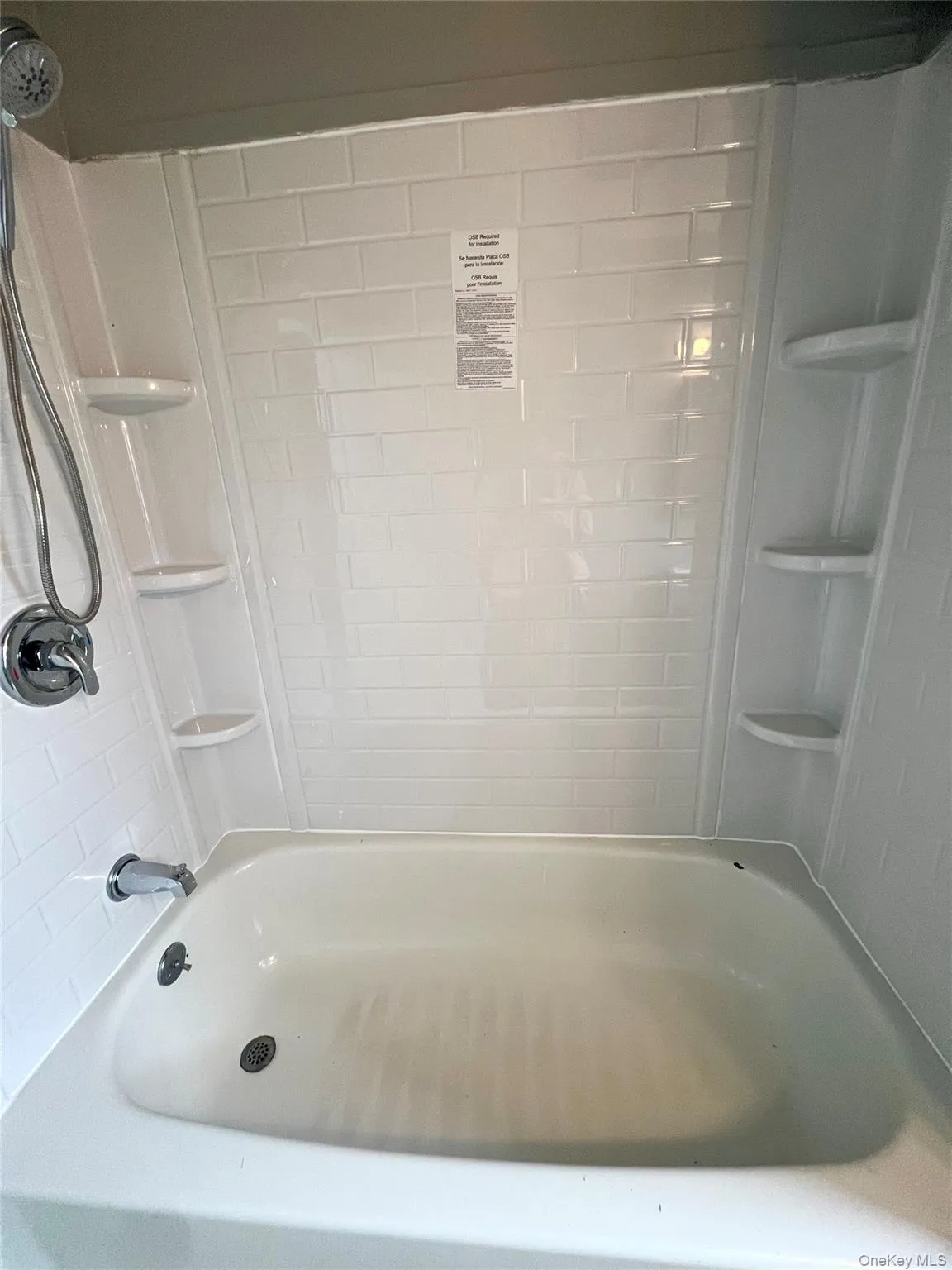 Full bathroom featuring shower / bath combination Full bathroom featuring shower / bath combination