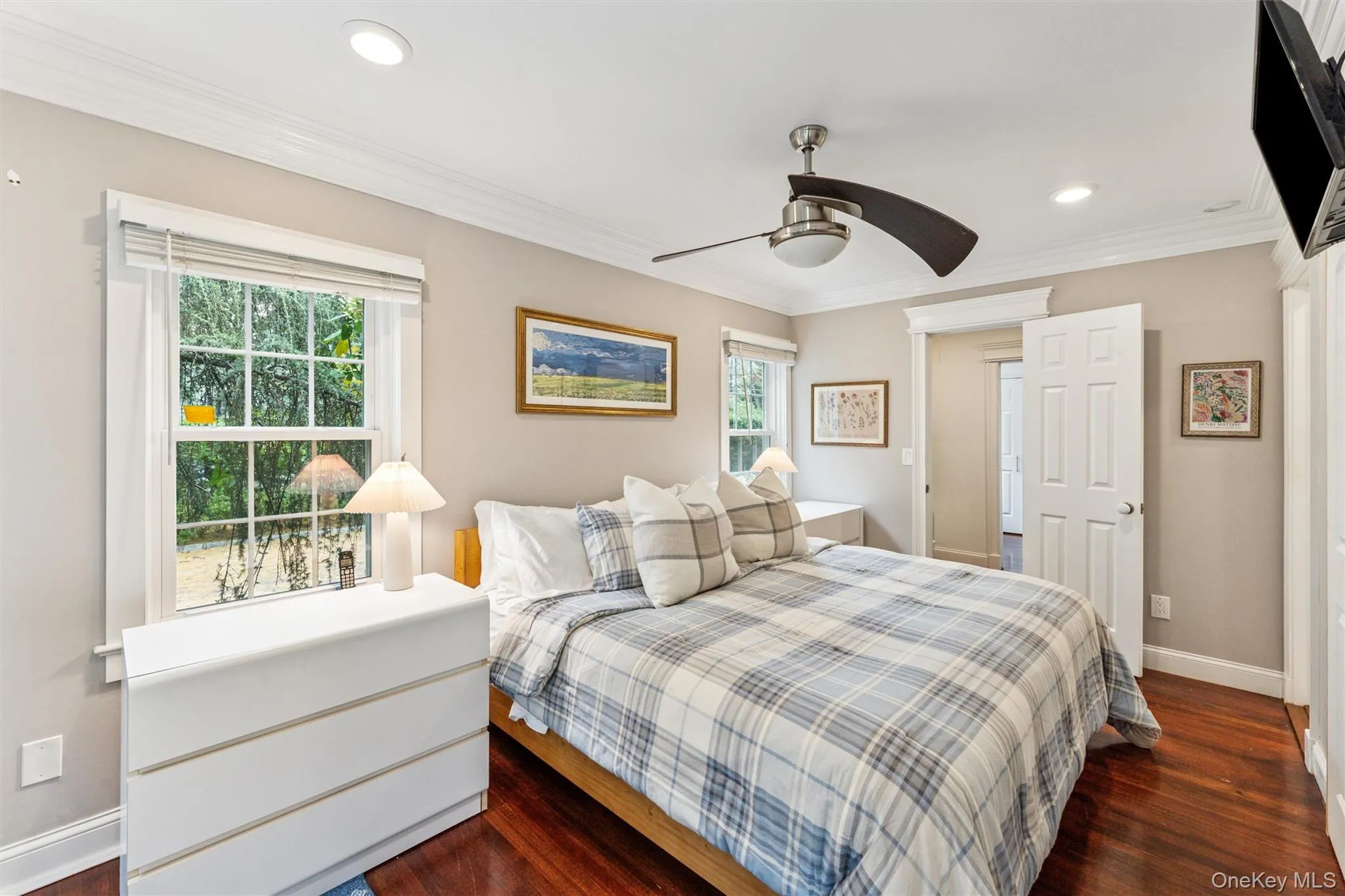 Bedroom with dark wood finished floors, crown molding, ceiling fan, and recessed lighting Bedroom with dark wood finished floors, crown molding, ceiling fan, and recessed lighting