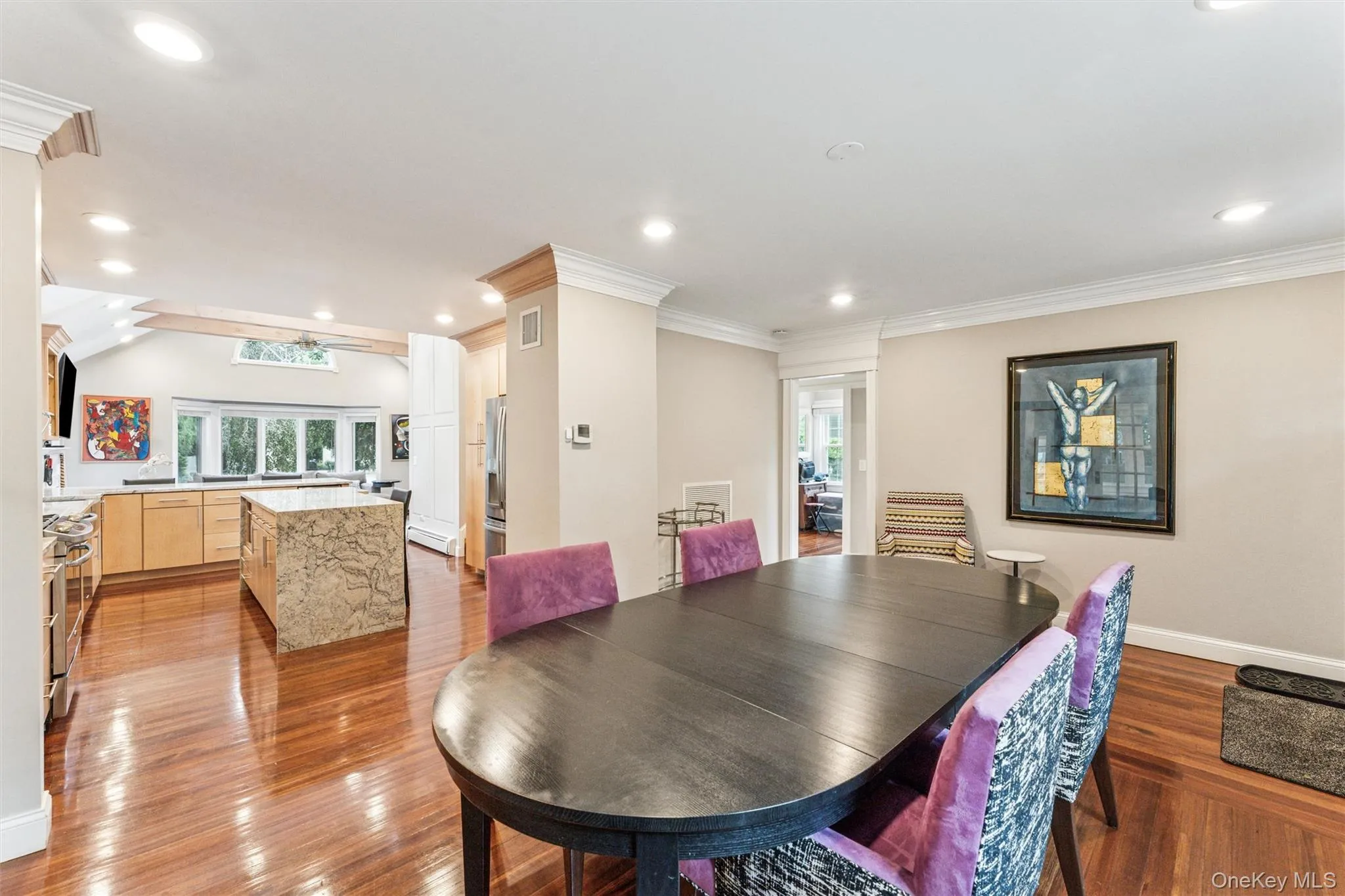 Dining space featuring recessed lighting, light wood-style floors, and crown molding Dining space featuring recessed lighting, light wood-style floors, and crown molding