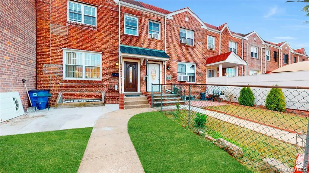 View of front of house with brick siding and a residential view View of front of house with brick siding and a residential view