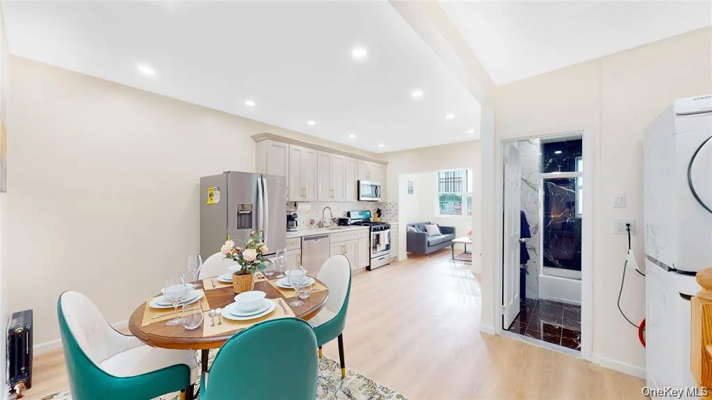 Dining room featuring light wood finished floors and recessed lighting Dining room featuring light wood finished floors and recessed lighting