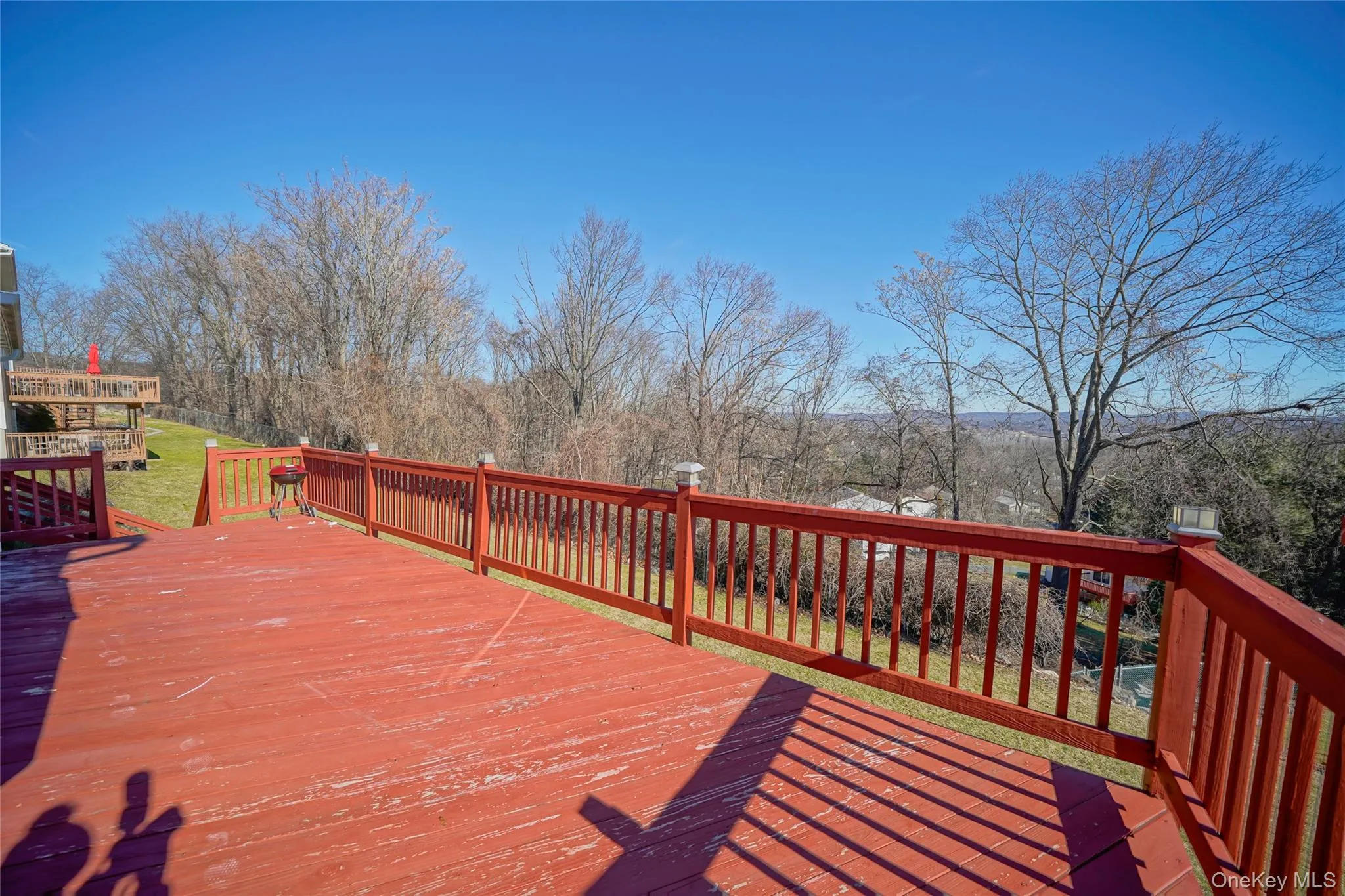 Deck featuring a lawn Deck featuring a lawn