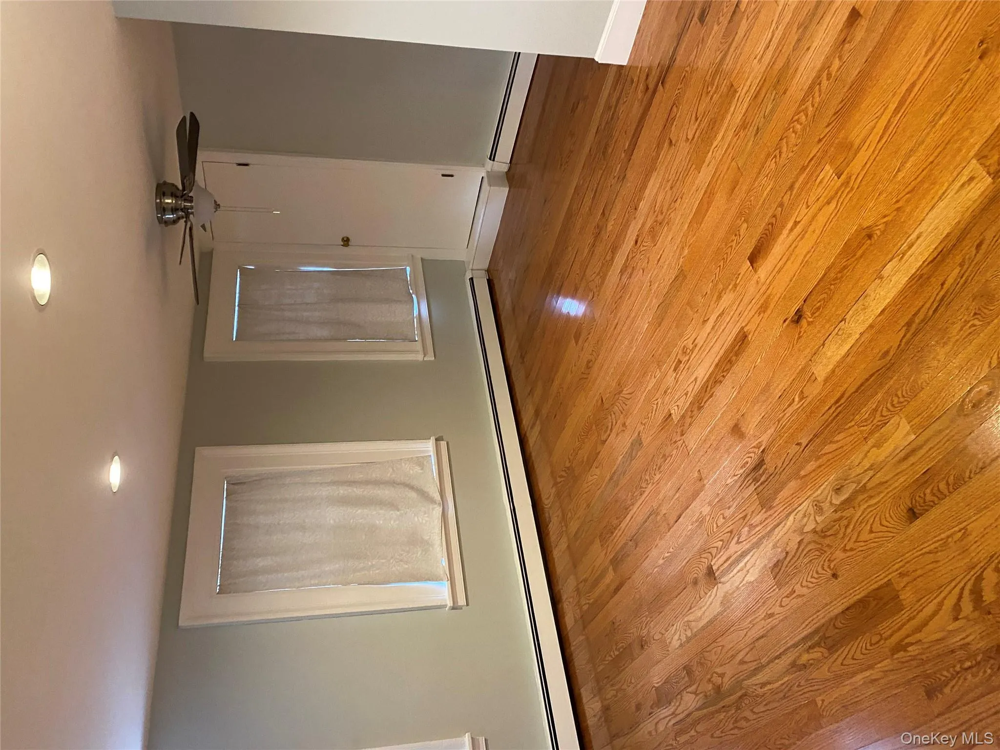 Spare room with a baseboard heating unit, light wood-type flooring, recessed lighting, and ceiling fan Spare room with a baseboard heating unit, light wood-type flooring, recessed lighting, and ceiling fan