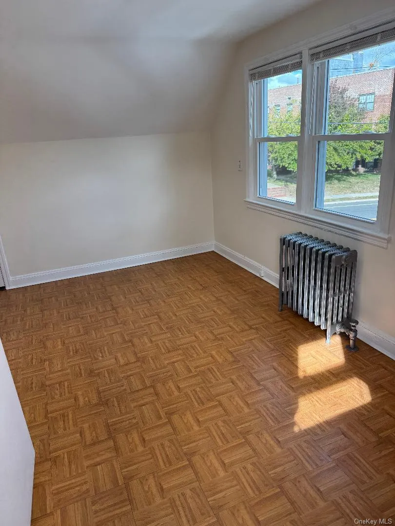 Additional living space with radiator and lofted ceiling Additional living space with radiator and lofted ceiling