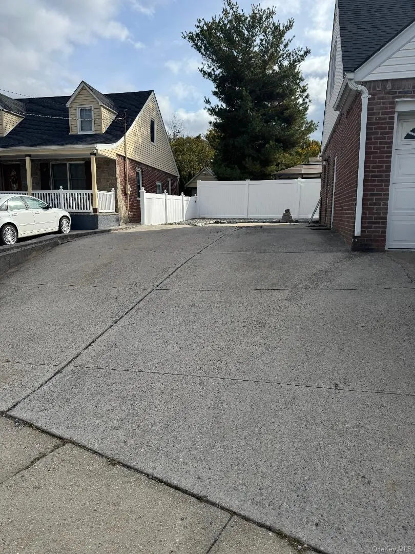 View of property exterior featuring brick siding and covered porch View of property exterior featuring brick siding and covered porch