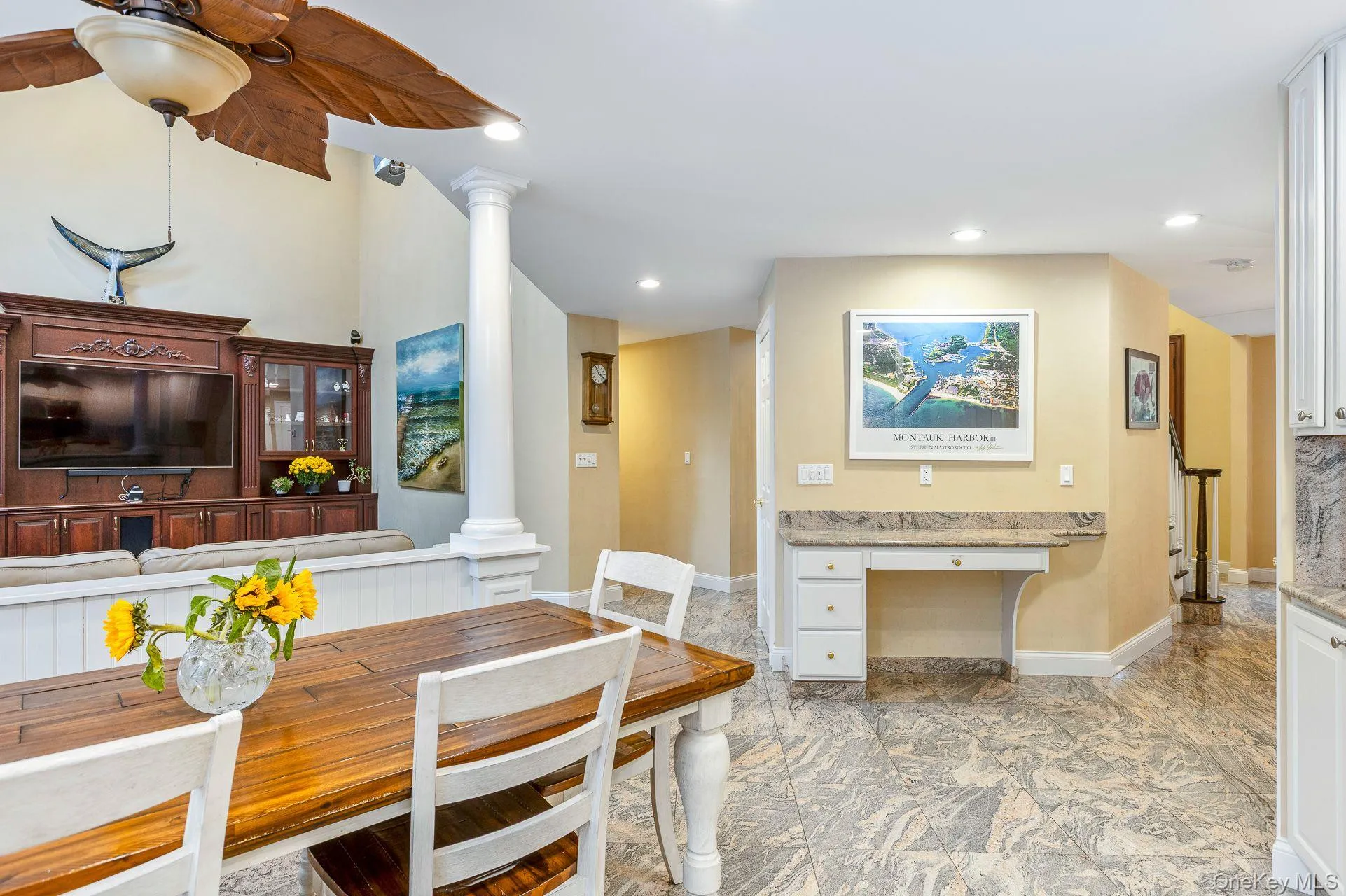 Dining room with decorative columns, recessed lighting, and built in desk Dining room with decorative columns, recessed lighting, and built in desk