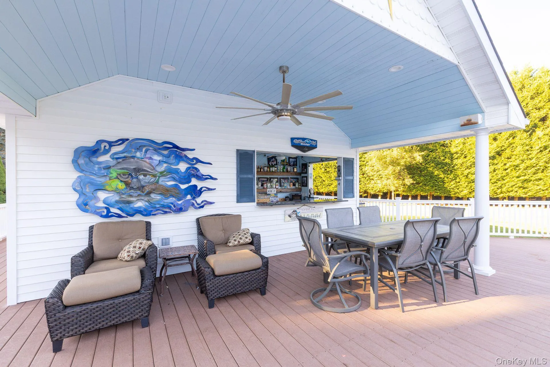 Deck featuring outdoor dining area and a ceiling fan Deck featuring outdoor dining area and a ceiling fan