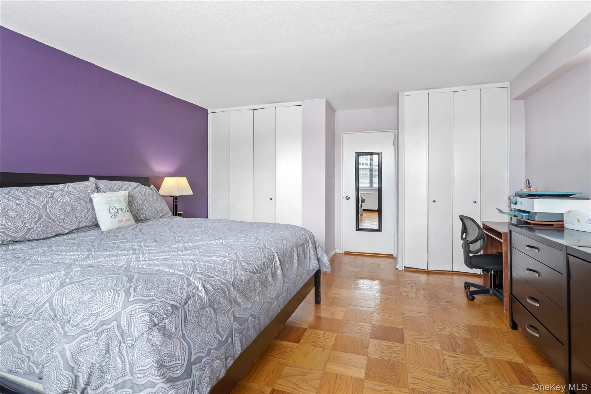 Bedroom featuring two closets and an office area Bedroom featuring two closets and an office area