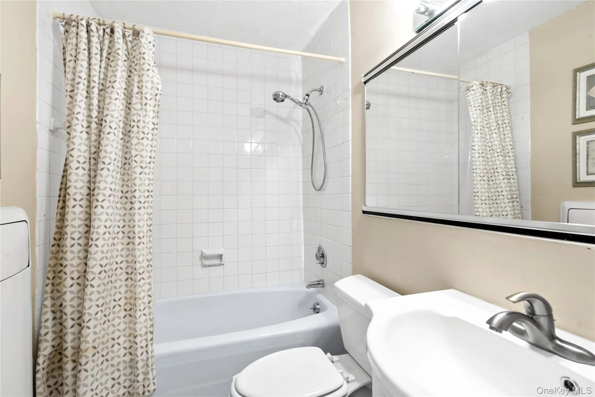 Full bath with shower / bathtub combination with curtain and vanity Full bath with shower / bathtub combination with curtain and vanity