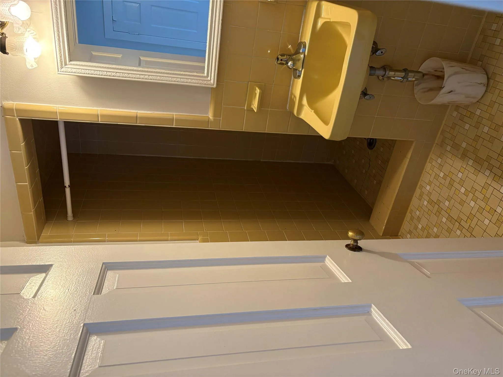 Full bathroom featuring a stall shower, tile walls, and tile patterned flooring Full bathroom featuring a stall shower, tile walls, and tile patterned flooring