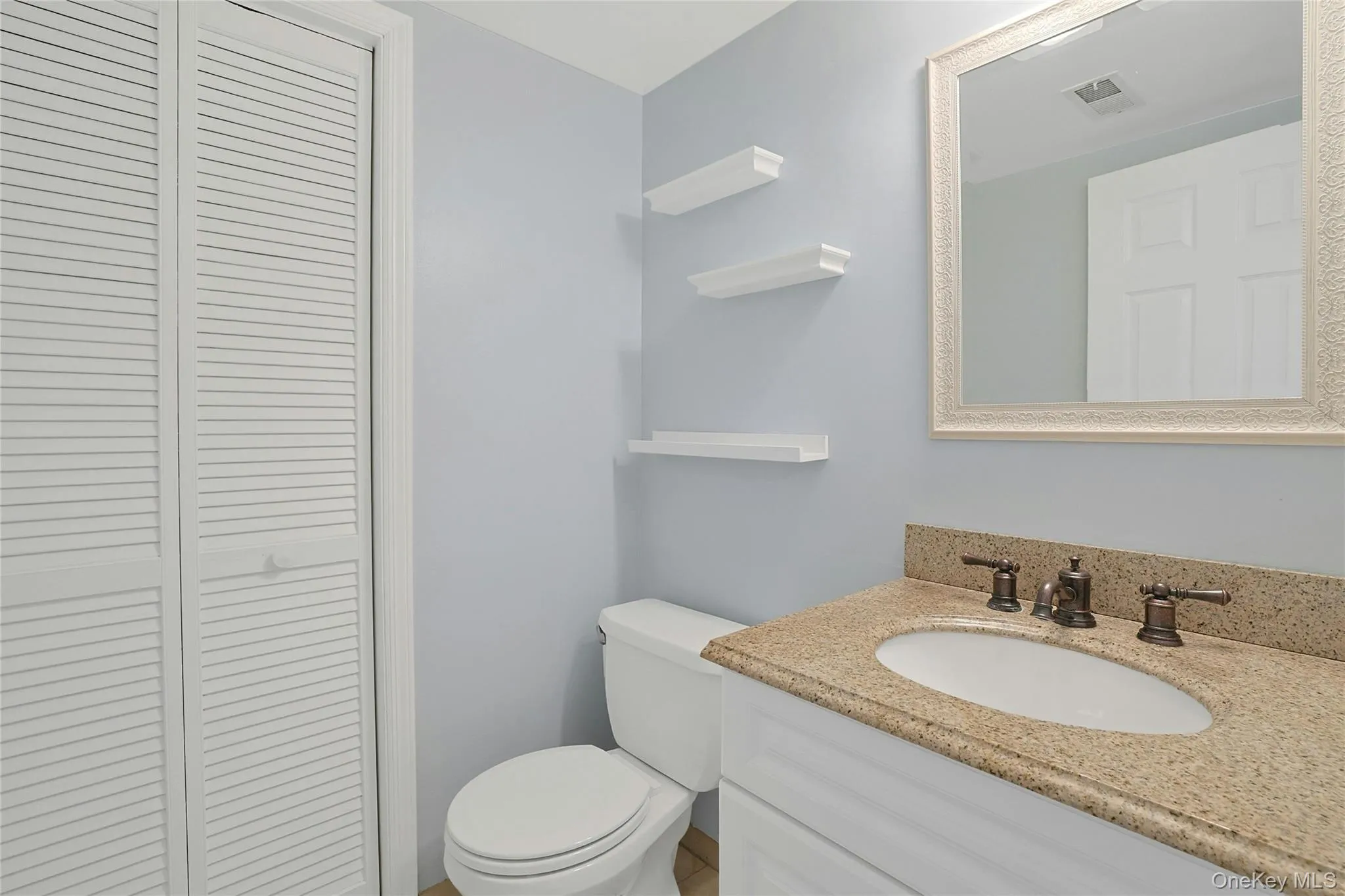 Powder Room/Half bathroom with laundry. Powder Room/Half bathroom with laundry.