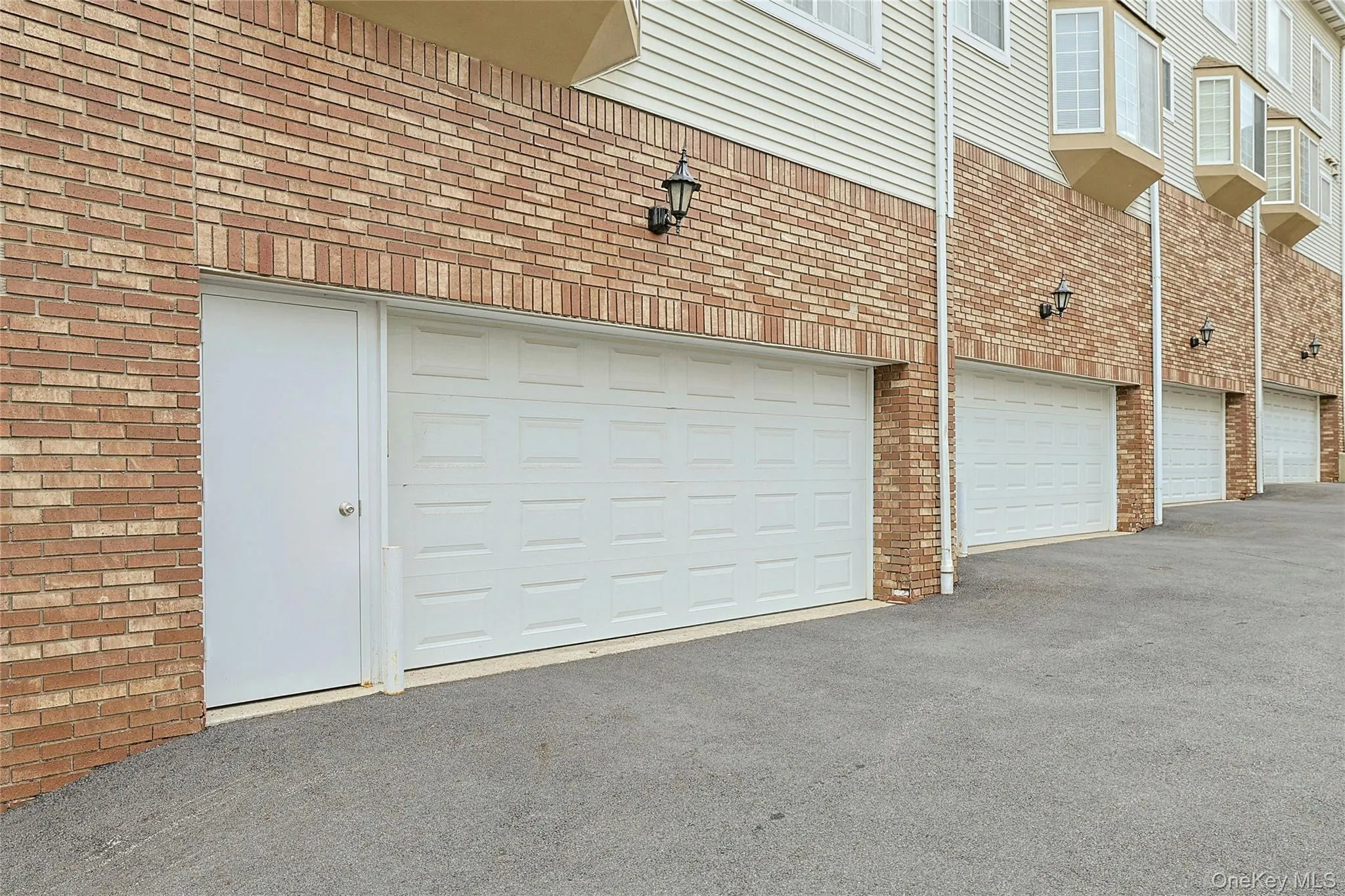 Shared garage includes 2 indoor tandem parking spaces and convenient easy-access door. Shared garage includes 2 indoor tandem parking spaces and convenient easy-access door.