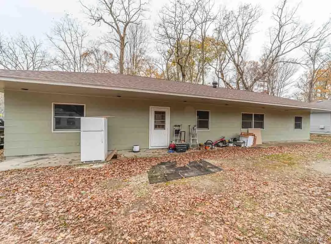 Rear view of house with roof with shingles Rear view of house with roof with shingles