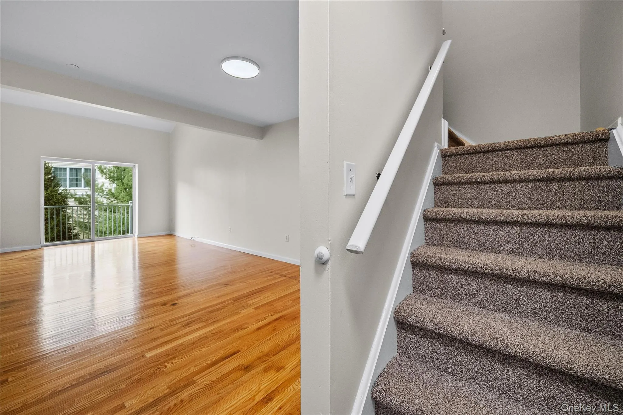 Staircase with wood finished floors and baseboards Staircase with wood finished floors and baseboards