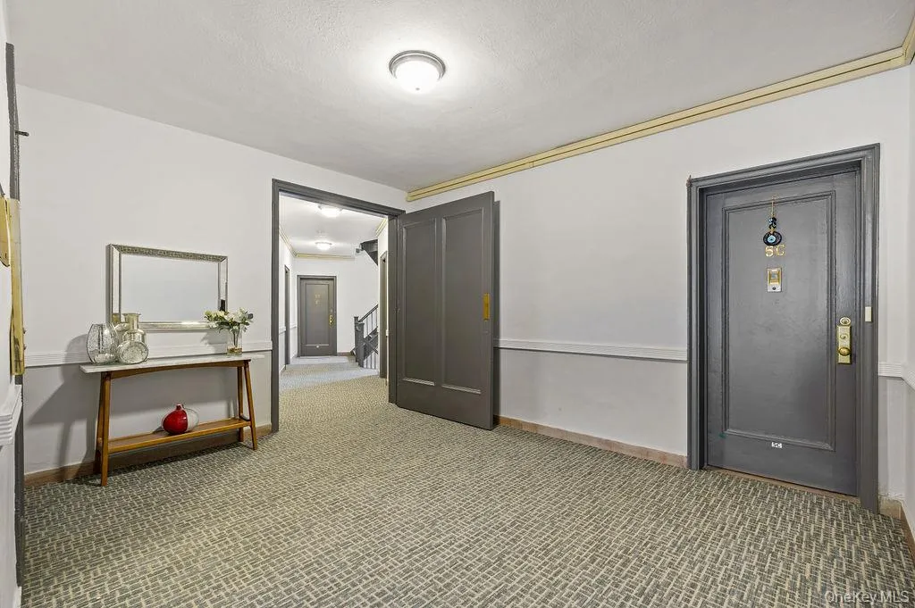 Hall with carpet flooring and stairs Hall with carpet flooring and stairs