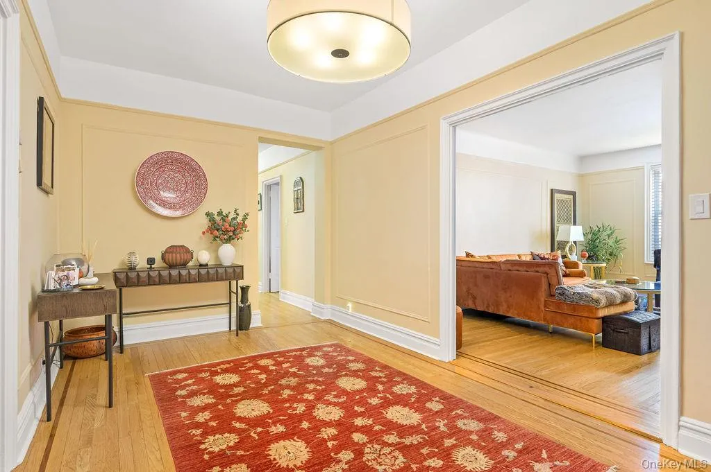 Hallway featuring light wood finished floors Hallway featuring light wood finished floors