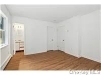 Unfurnished room featuring dark wood finished floors Unfurnished room featuring dark wood finished floors