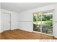 Empty room featuring dark wood-style floors Empty room featuring dark wood-style floors