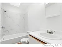 Full bathroom featuring vanity and bathtub / shower combination Full bathroom featuring vanity and bathtub / shower combination