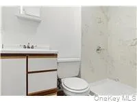 Full bath with vanity and a stall shower Full bath with vanity and a stall shower
